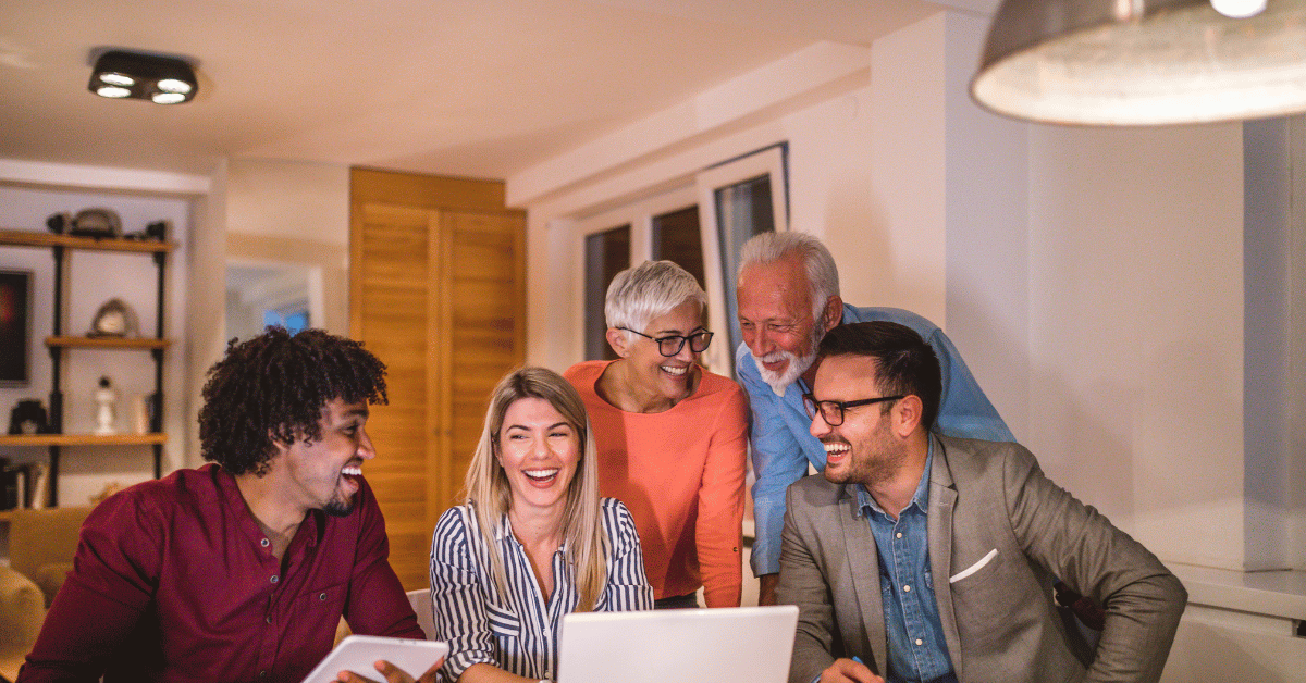 phone, fintech notebook, and coffee cup on table, with a hand over the notebook with a pen.