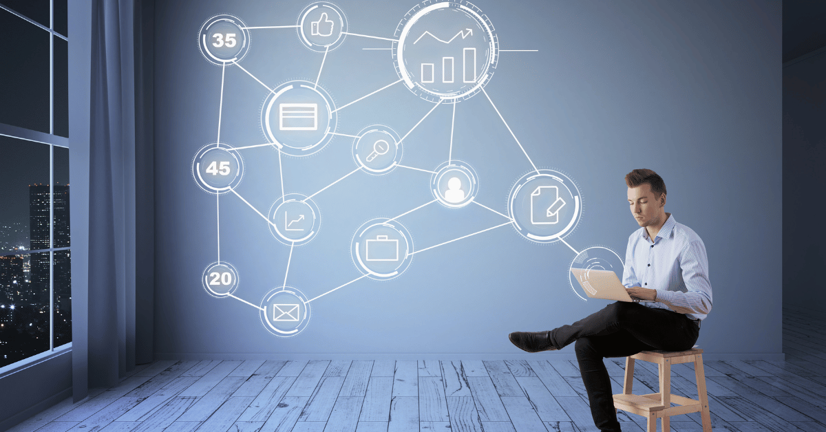 phone, fintech notebook, and coffee cup on table, with a hand over the notebook with a pen.